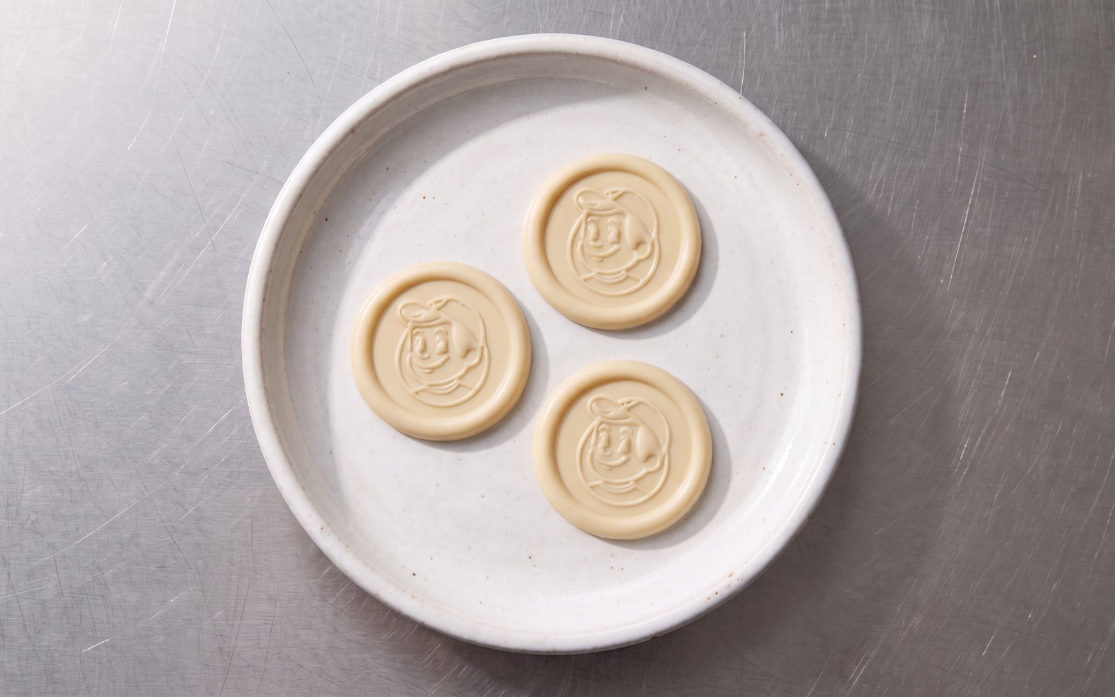 Choco-Loco white chocolate discs stamped with Mighty Archie